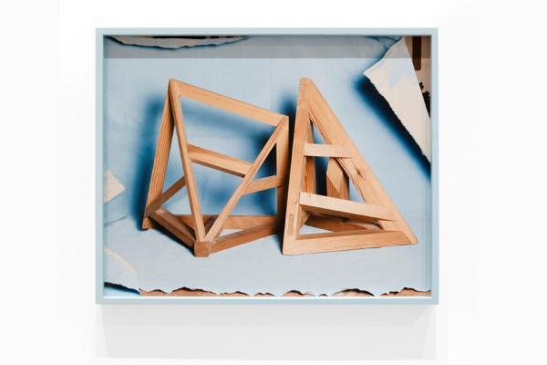 Framed photographs of hand-built wooden models