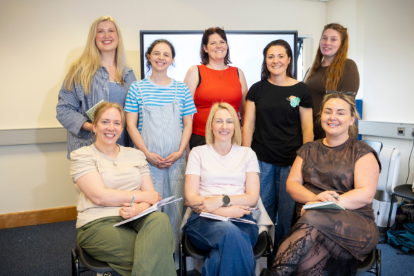 A group of women smiling at the camera