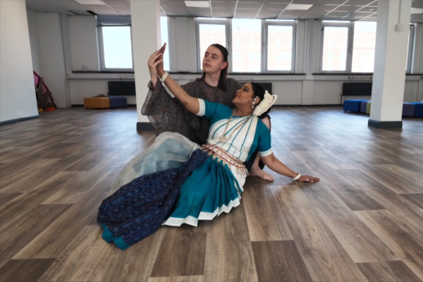 two women embraced in a dance