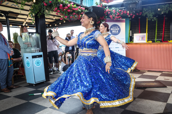 Dancer in a blue dress spinning around.