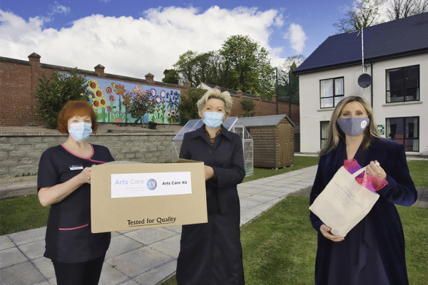 Gillian Mason of Bradley Manor Nursing Home, Grainne Kielty, Arts Care’s Artist in Residence and Jenny Elliott, CEO of Arts Care outside Bradley Manor Nursing Home holding the Arts Boxes that were delivered to residential and nursing care homes during the Covid-19 pandemic.