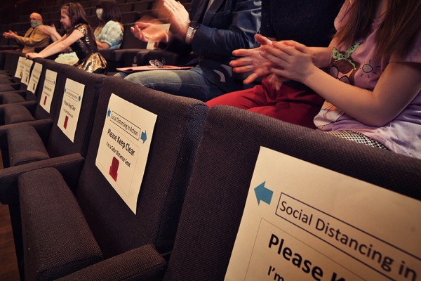 Row of empty seats in a theatre.