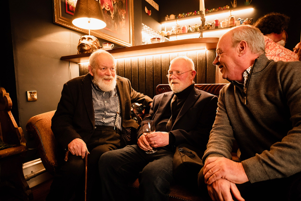 Michael Longley, Frank Ormsby and Arts Council Chair Liam Hannaway seated together having a conversation.