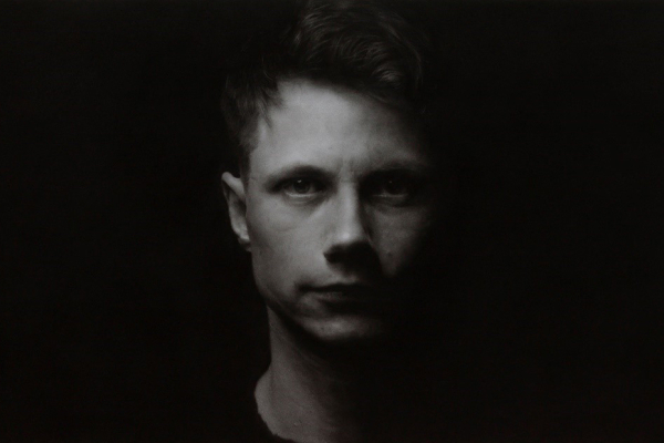 Pastel drawing by Mantas Poderys who was artist of the month for January 2022. The work is entitled Self Portrait at the age of 28 and is part of the ACNI art collection.