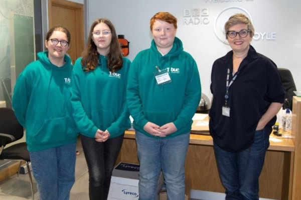 Spill the Tae creators, Caislin Conway, Hannah Curran, Rian Temple with BBC Radio Ulster presenter, Marie-Louise Muir, at the BBC Radio Foyle studio.