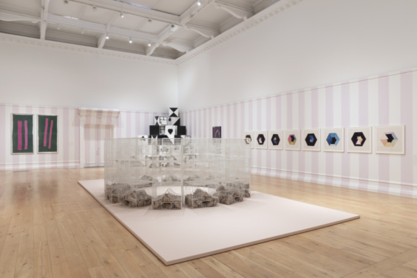 A gallery space with artwork on the walls.