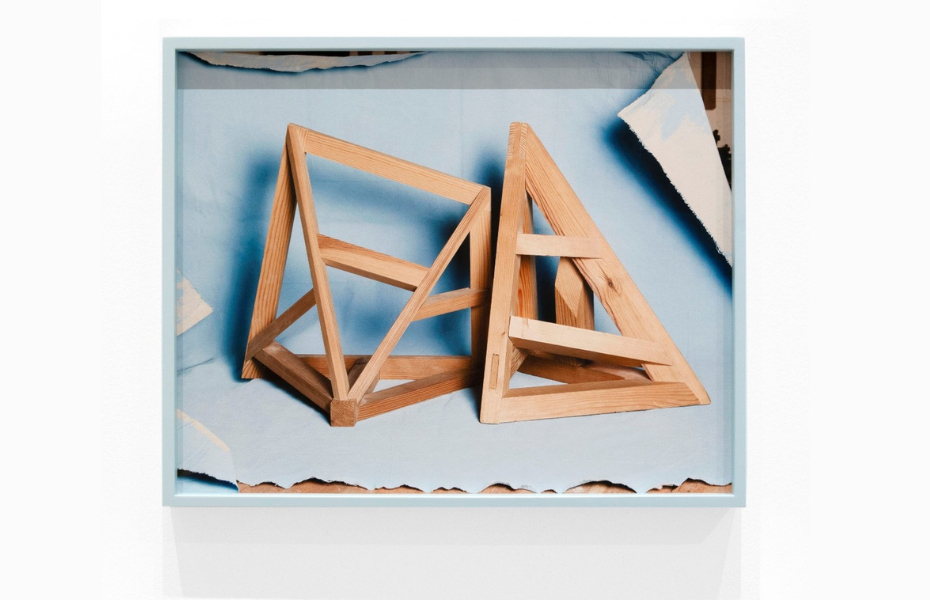 Framed photographs of hand-built wooden models