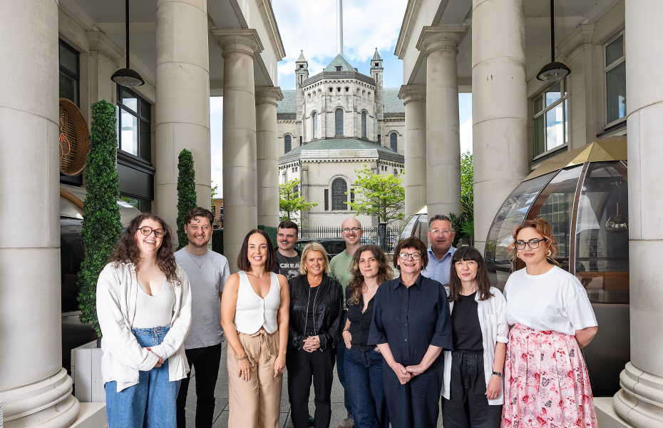A group of theatre makers standing together outside alongside the funders.