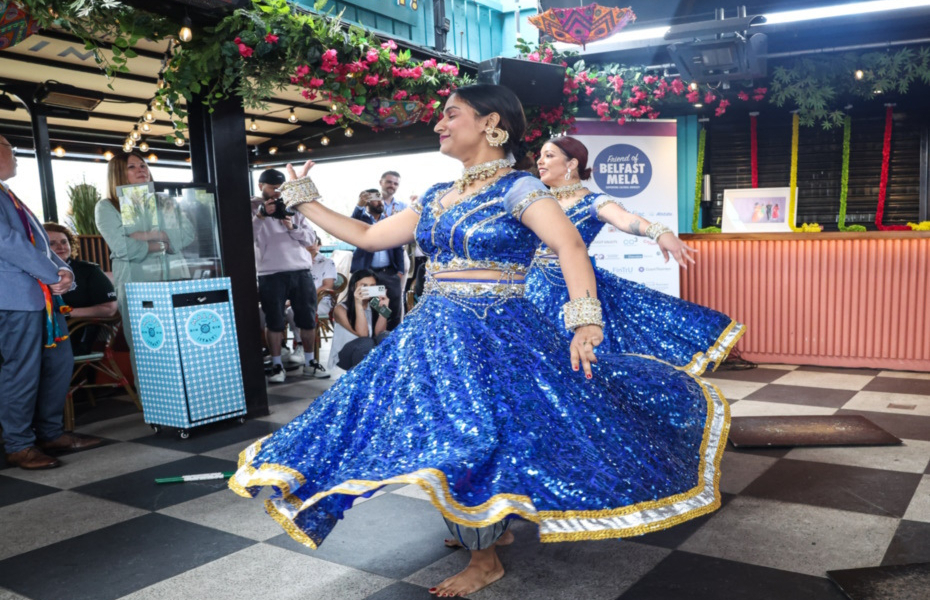 Dancer in a blue dress spinning around.