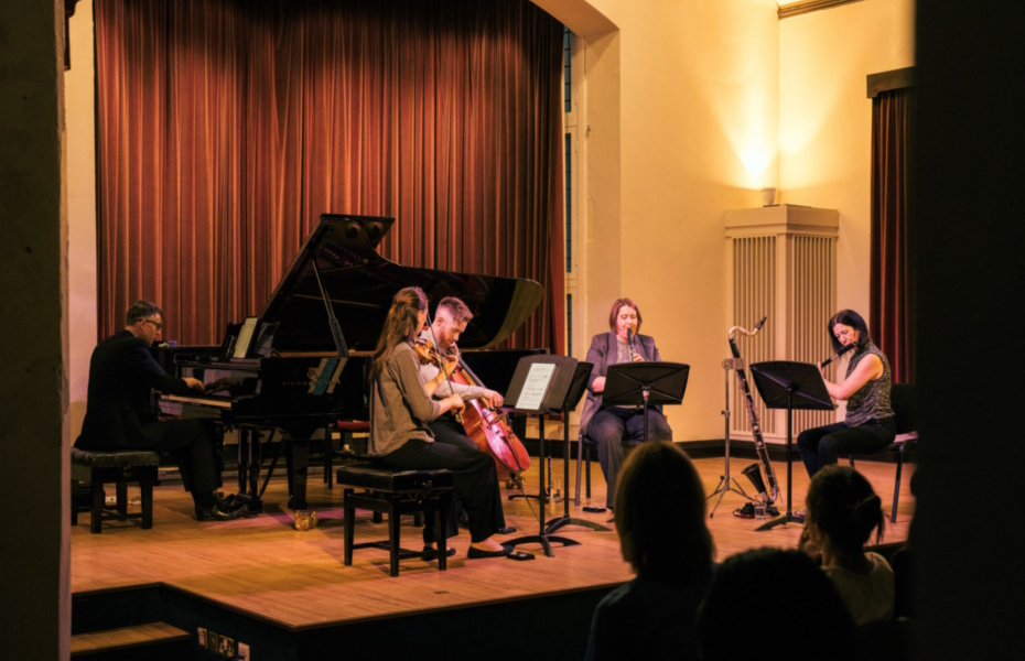A group of musicians on stage.