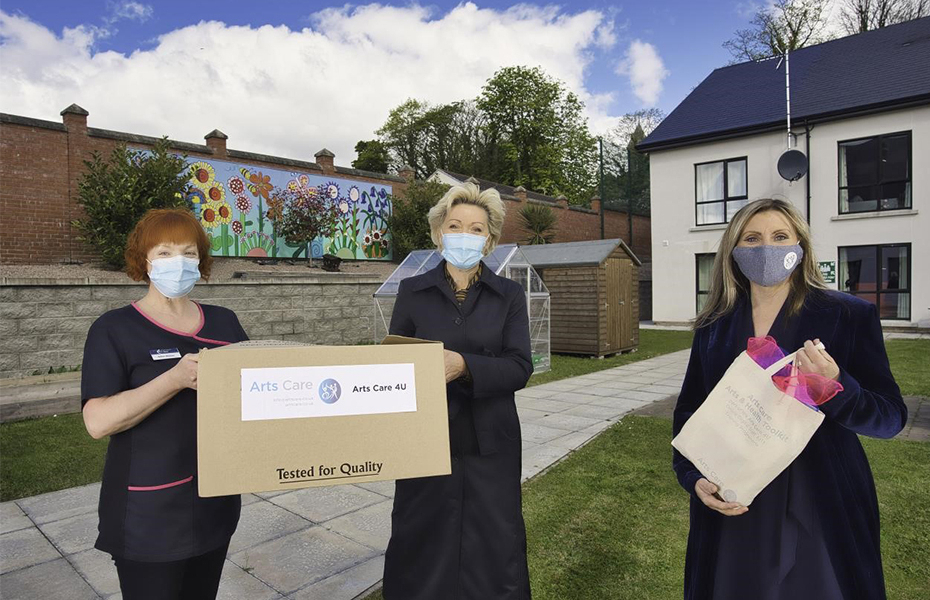 Gillian Mason of Bradley Manor Nursing Home, Grainne Kielty, Arts Care’s Artist in Residence and Jenny Elliott, CEO of Arts Care outside Bradley Manor Nursing Home holding the Arts Boxes that were delivered to residential and nursing care homes during the Covid-19 pandemic.