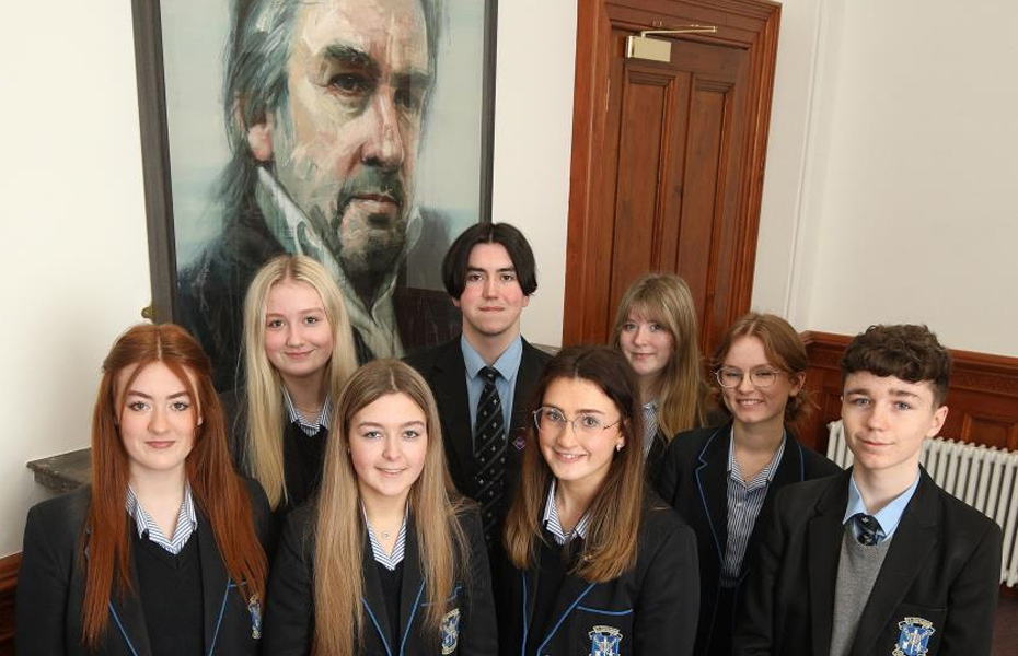 Students at St Louis Grammar school pictured in front of Colin Davidson's portrait of pianist and conductor Barry Douglas