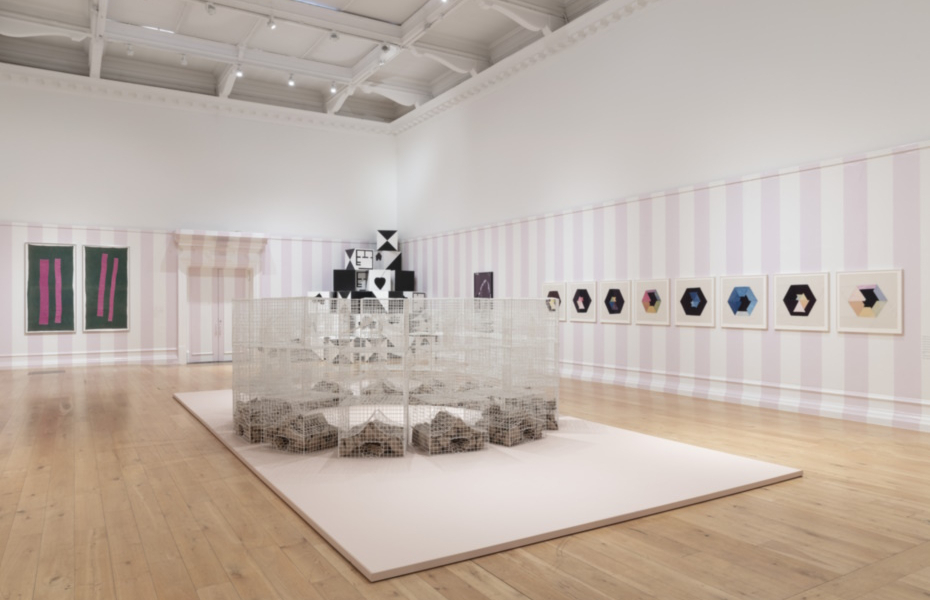 A gallery space with artwork on the walls.